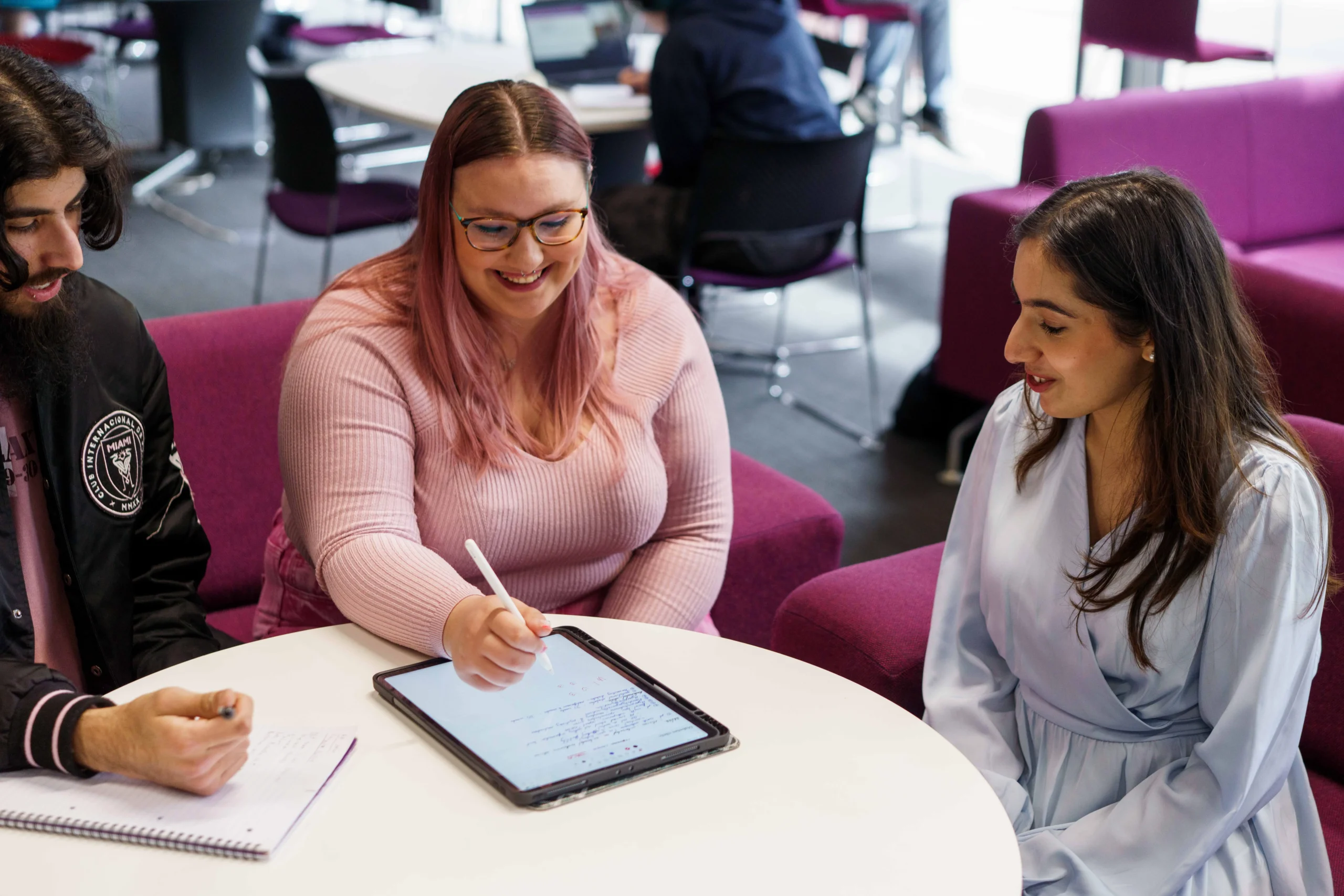 Computer Science Career Prospects Aston Online - female colleagues sitting at a table looking at ipad