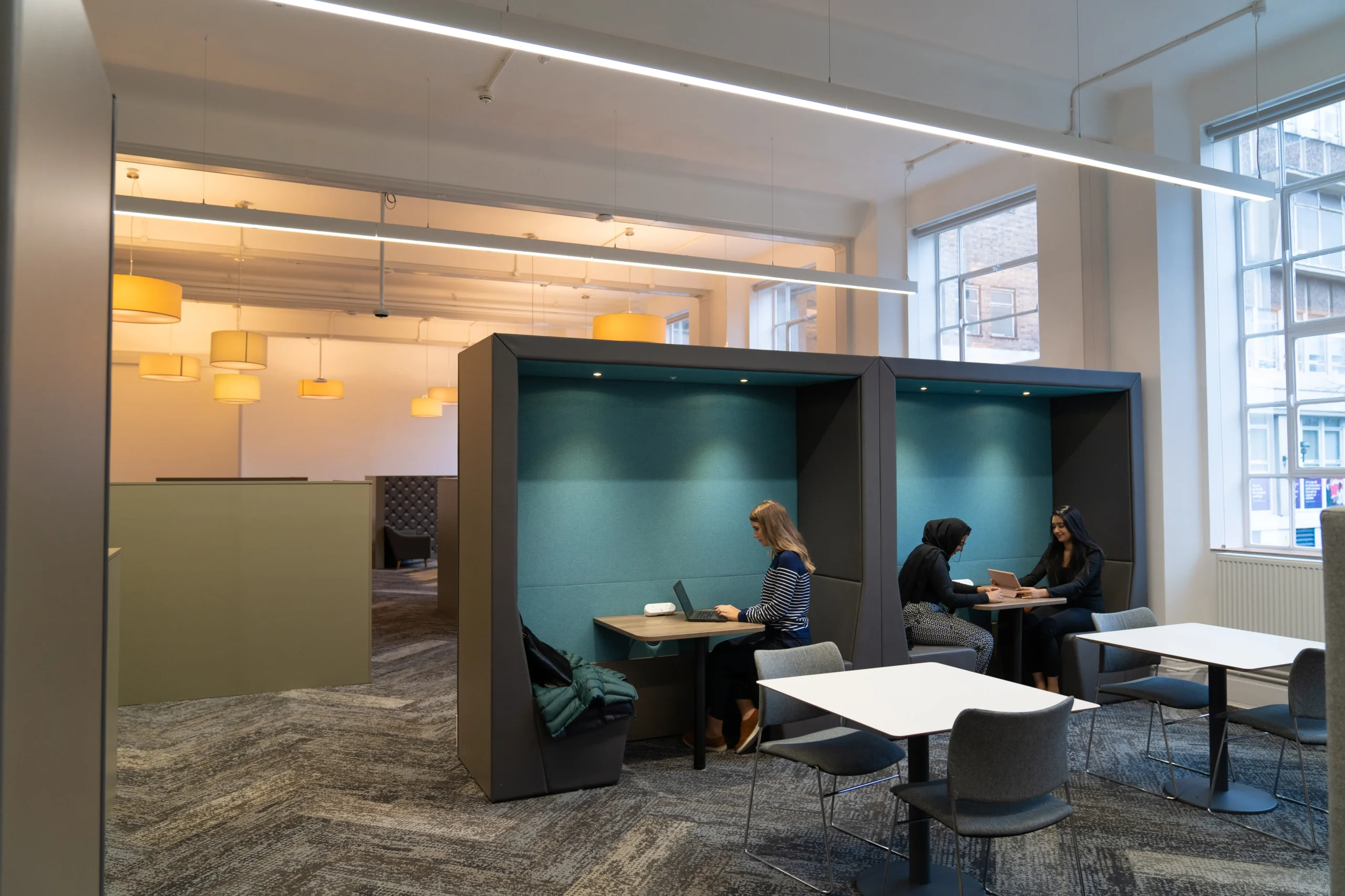 Explore a real-world ransomware attack: DragonForce and the future of cyber defence - students working in office pods