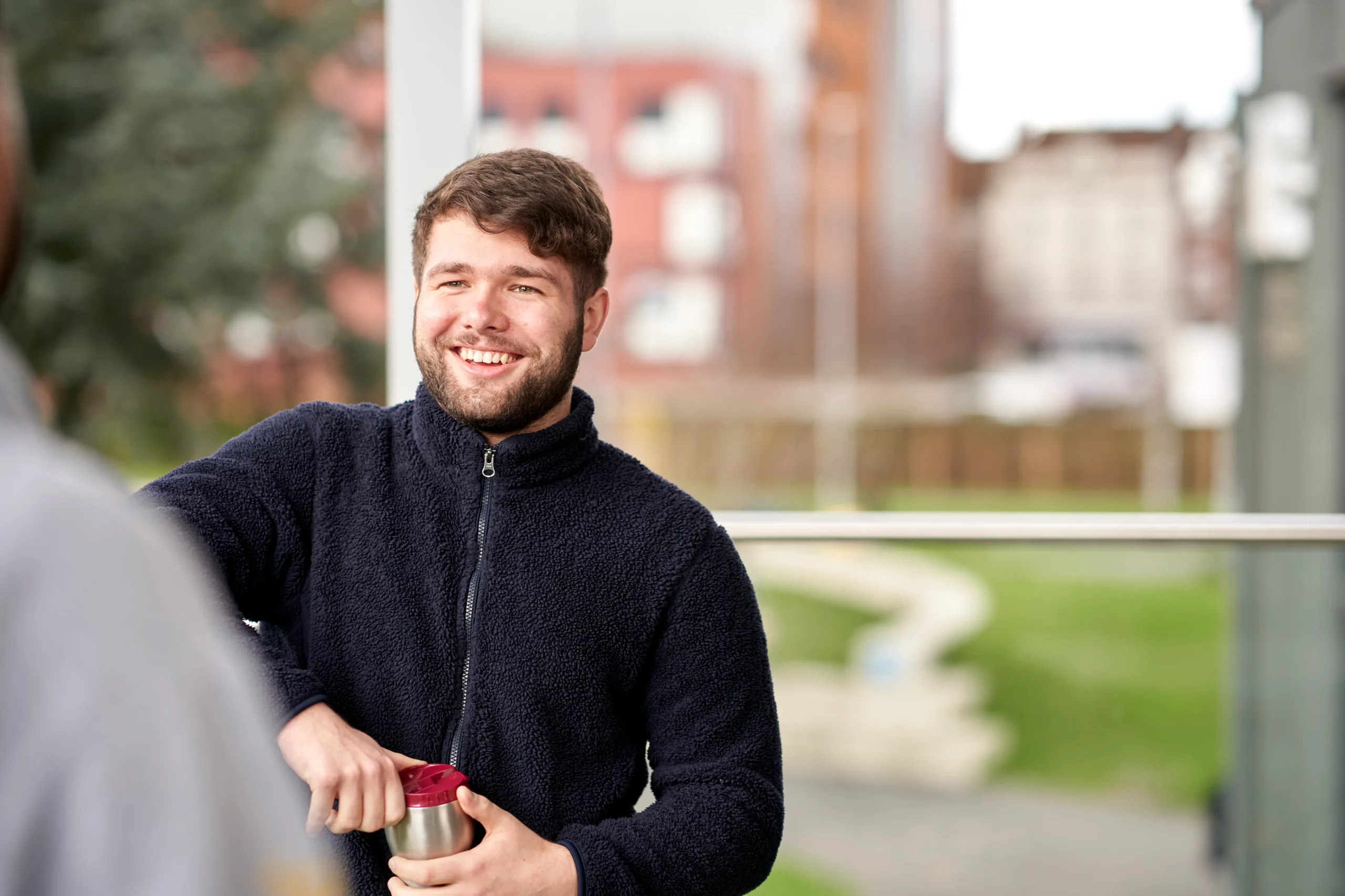 How to become an epidemiologist in the UK - smiling man in conversation