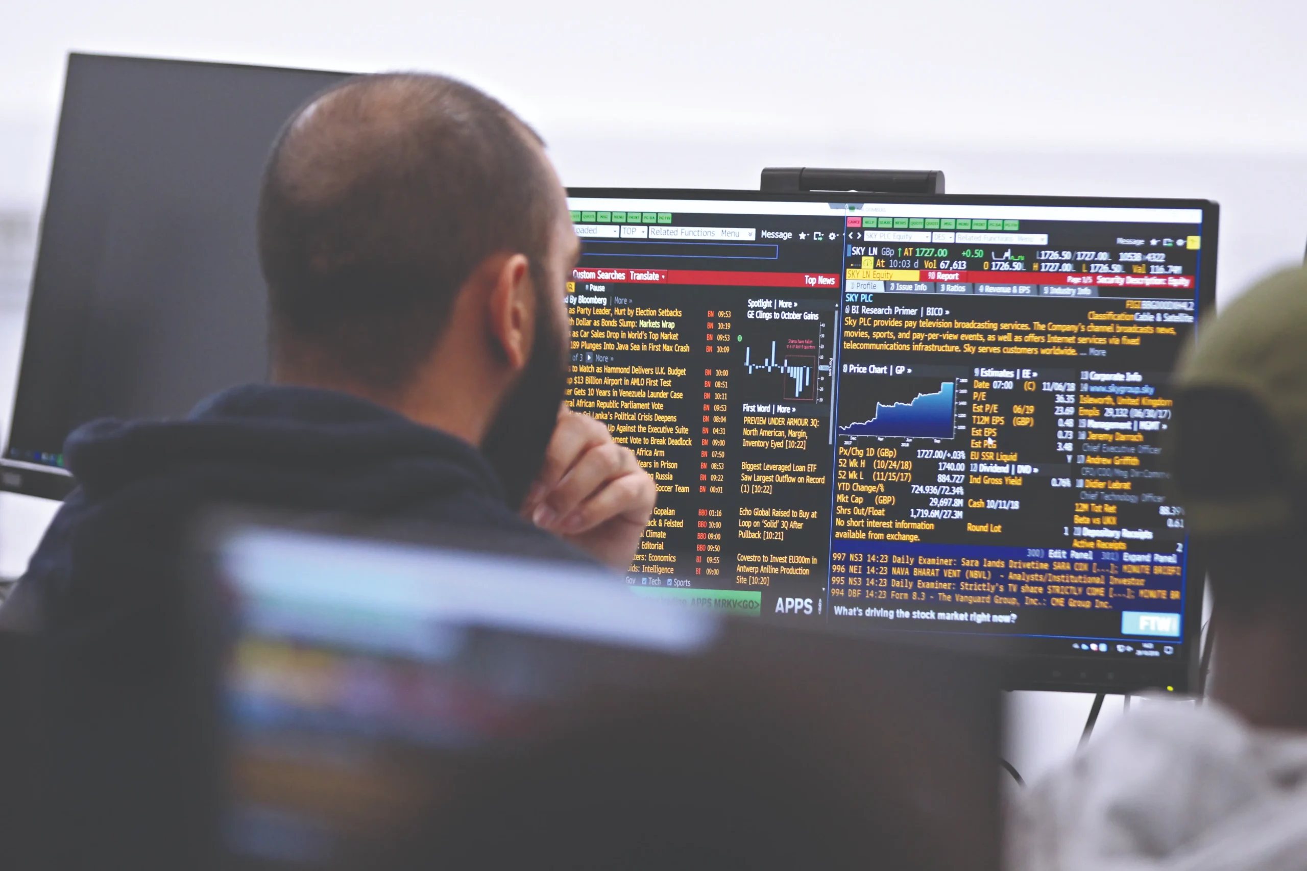 Preparing for a career in Business Analytics - man in computer lab looking at data