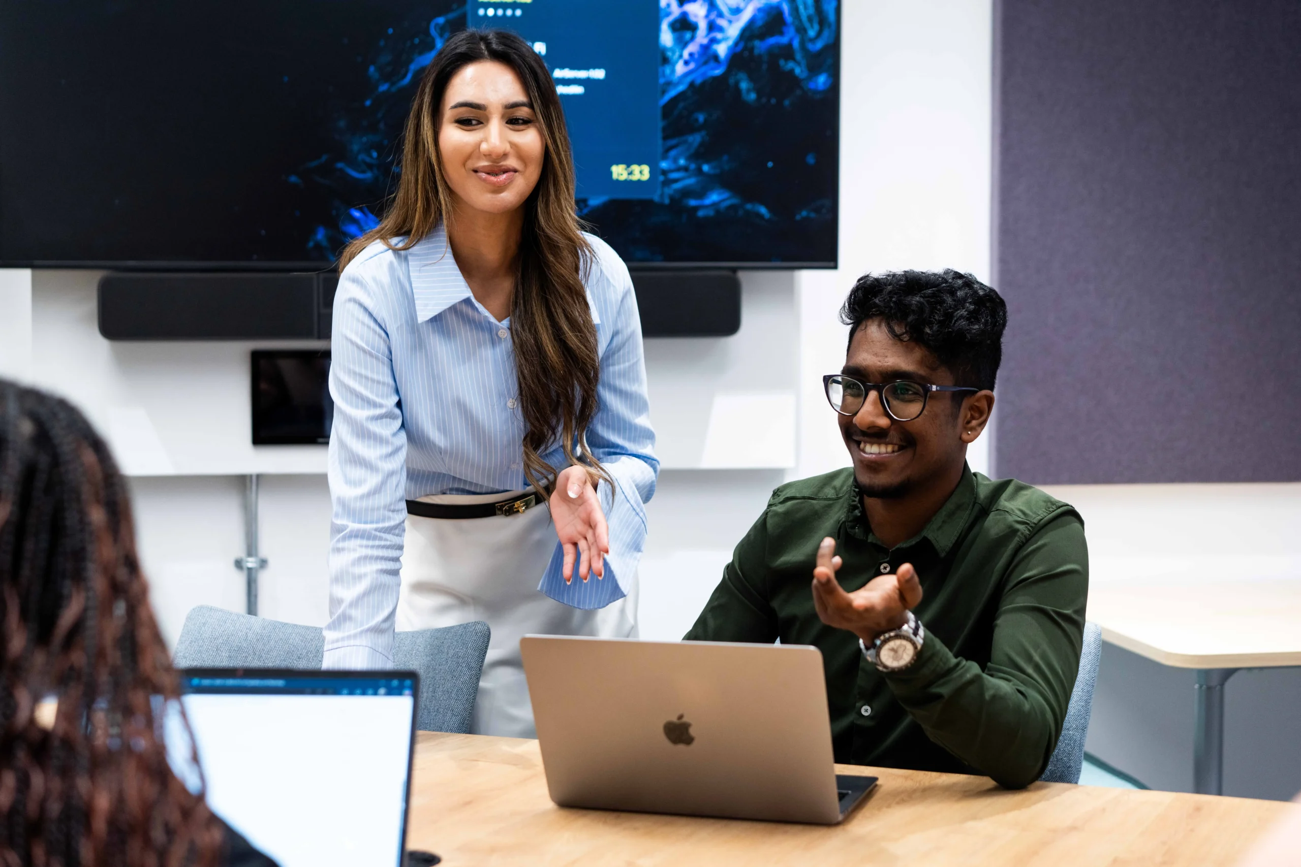 What can you do with a DBA - two people discussing business over a laptop