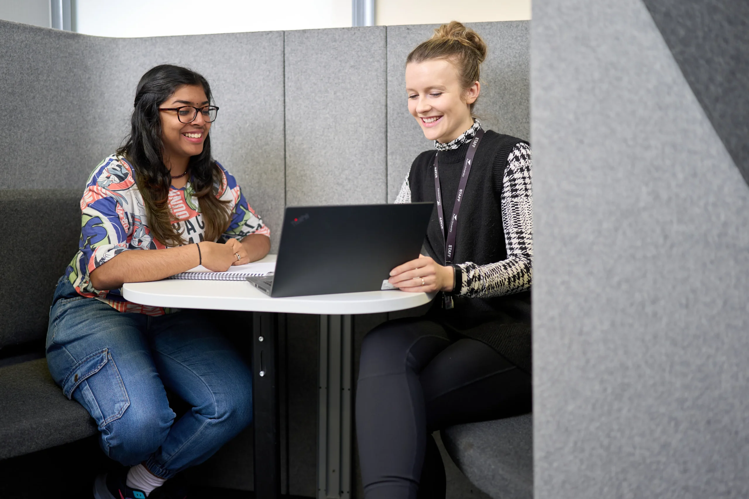 10 careers you can have with a BSc in Psychology - two women in grey pod having meeting with one computer