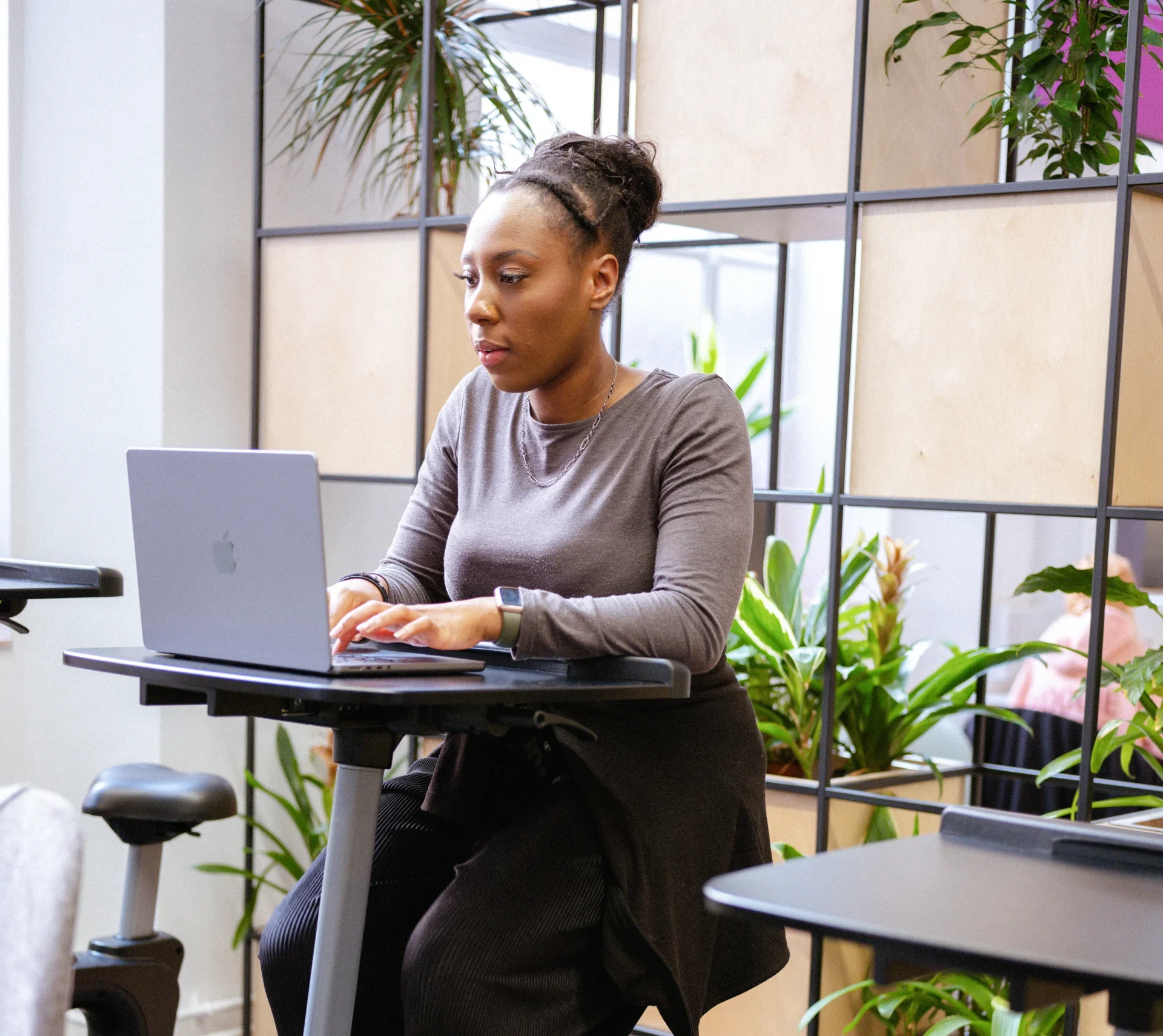 A deep dive into a Business Analytics (MSc) programme from Aston Online - woman on laptop in modern office space