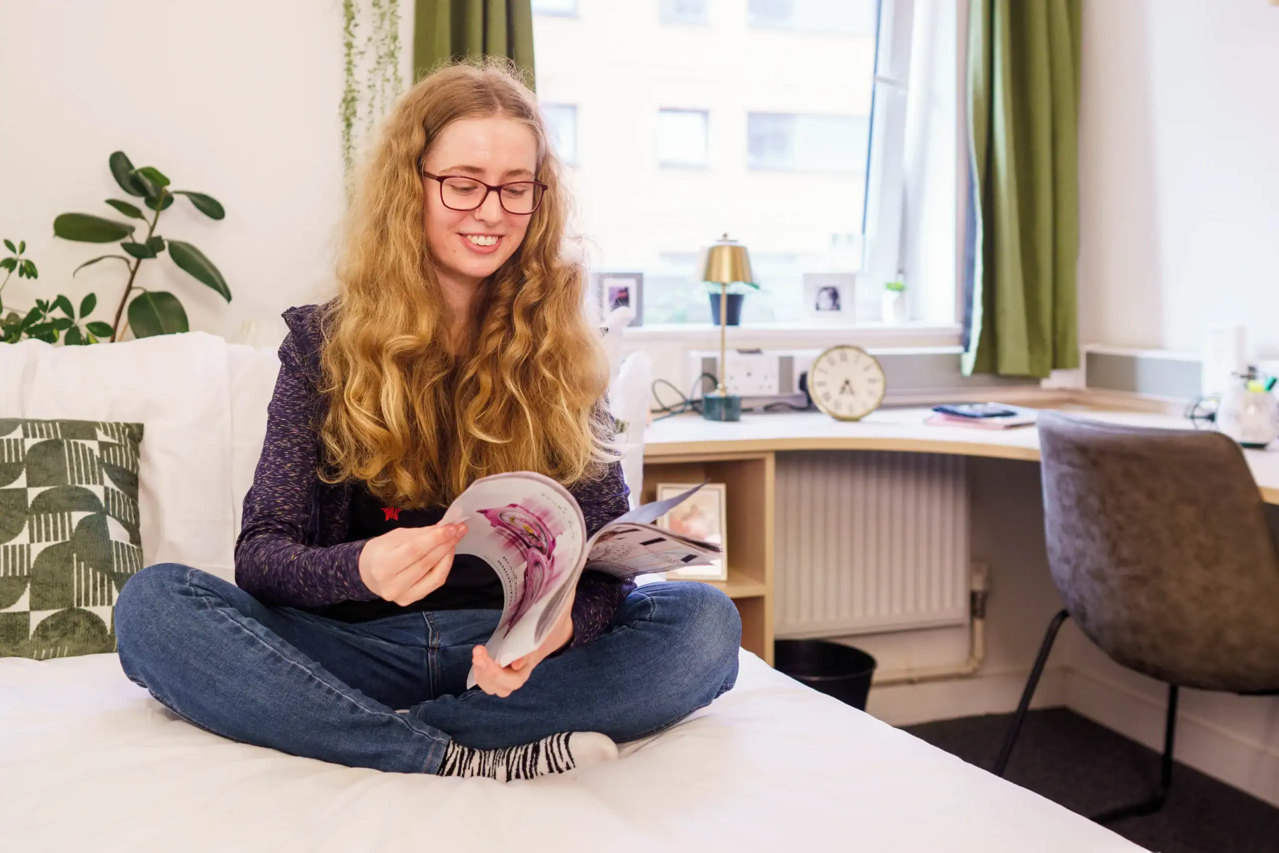 How to personalise your learning journey at Aston Online - feature image - woman reading a magazine on the bed