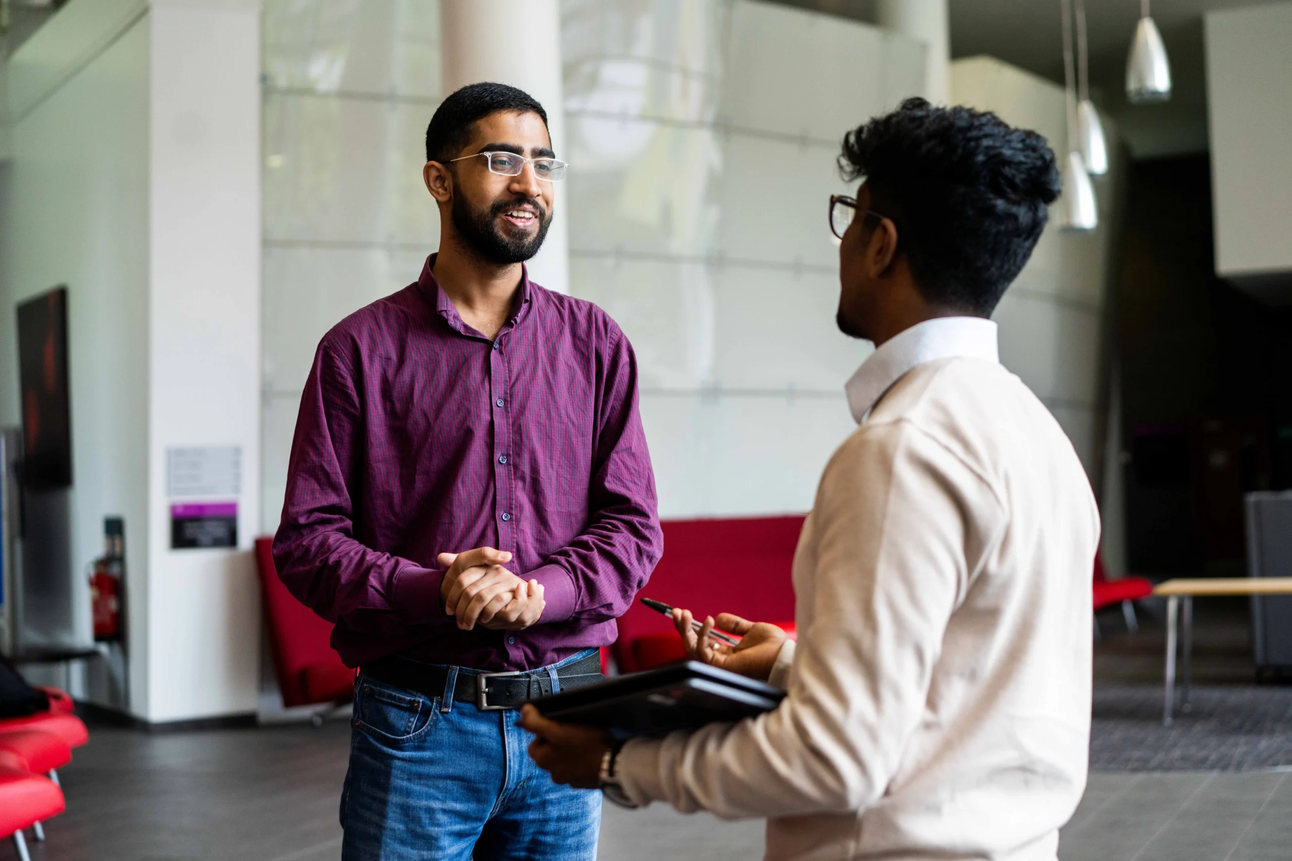 Business Career Prospects Aston Online - two colleagues talking in a working environment