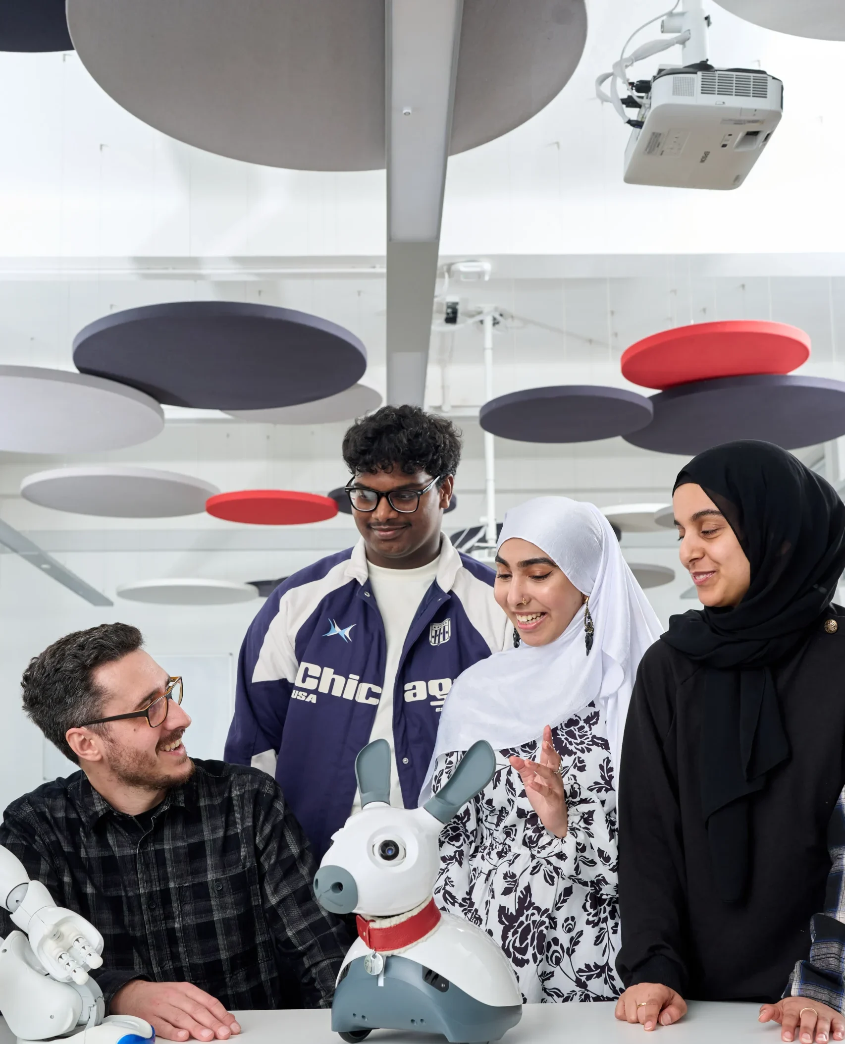 Computer Science BSc Career Prospects - team of four individuals standing around a robotic dog
