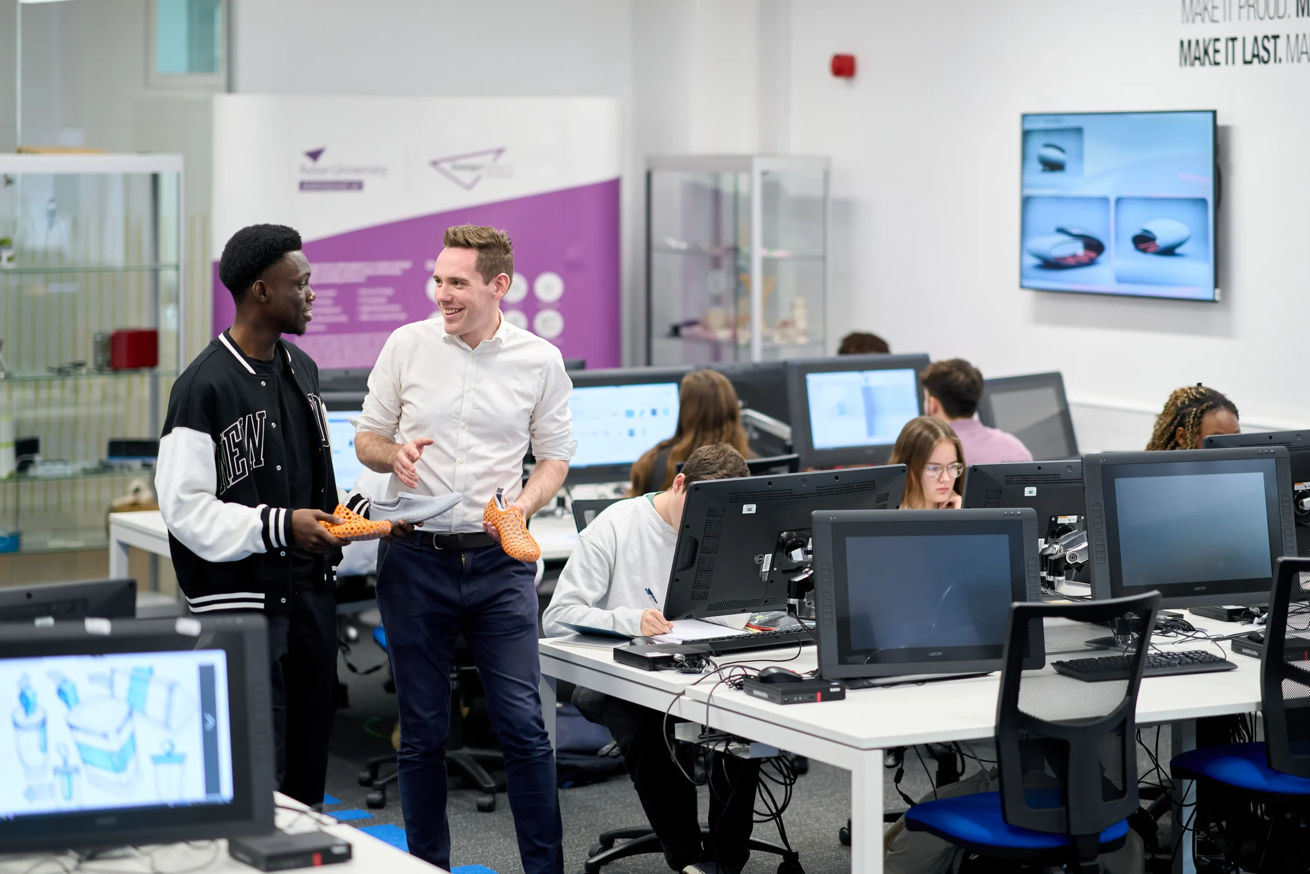 Computer Science and Cybersecurity - Two men walking and talking in university setting