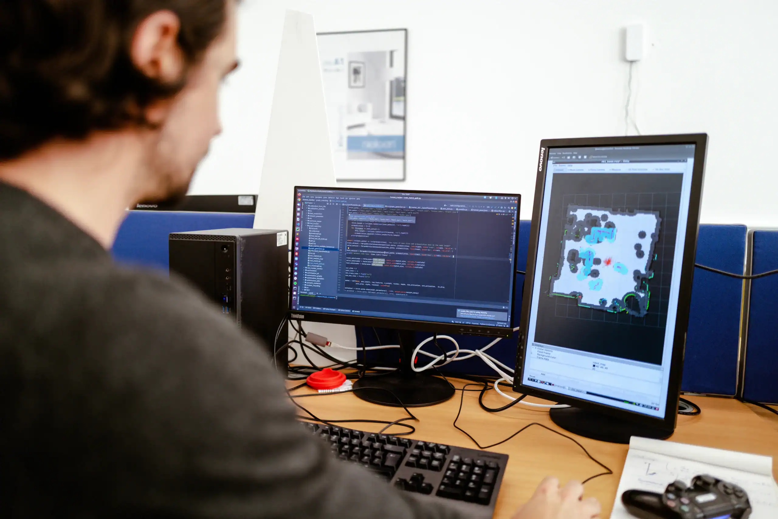 Fundamental cybersecurity practices – Protecting yourself and your organisation - over shoulder shot of man working on two screens