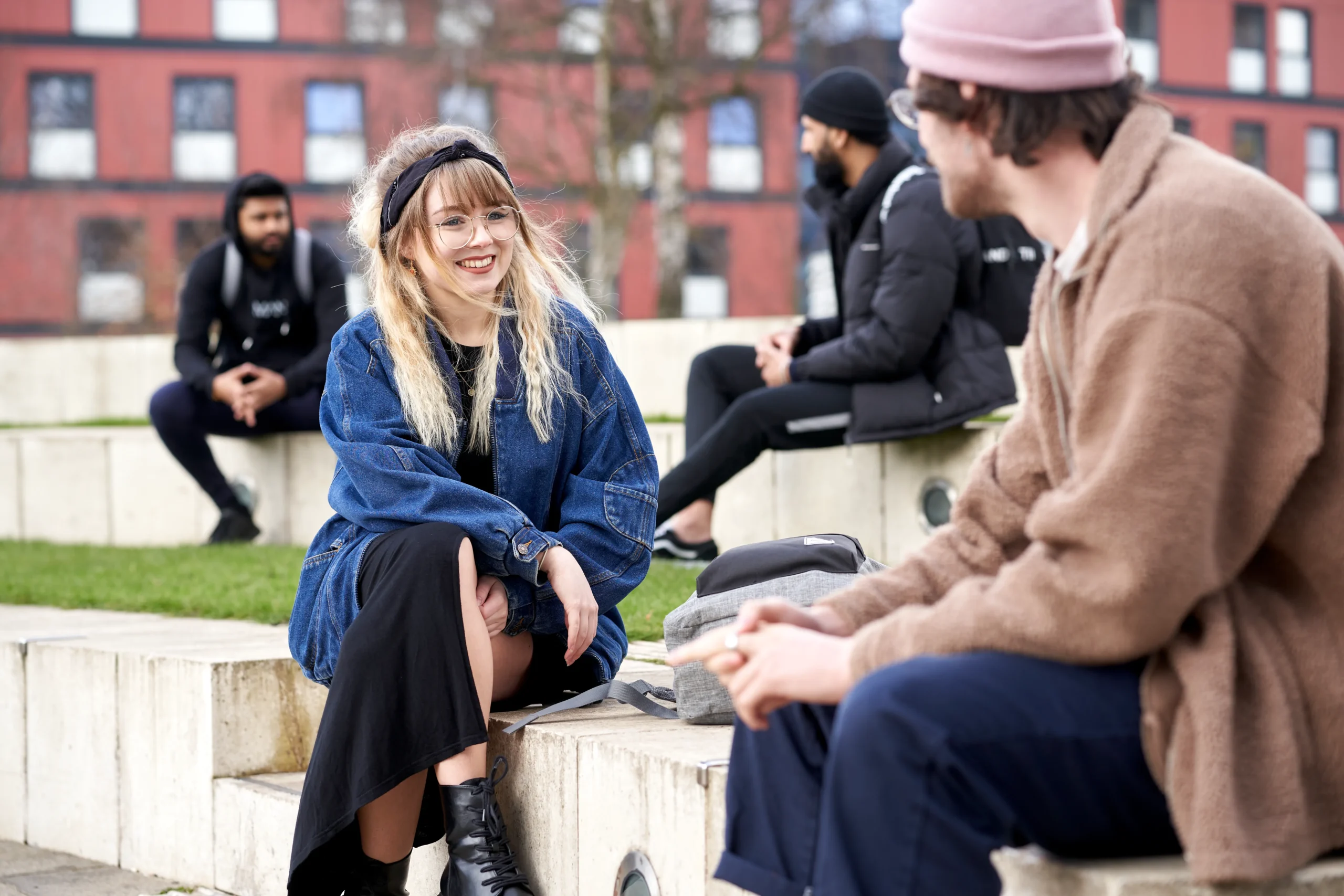 How online learners at Aston Online build real connections and professional networks - two students sitting outside in conversation