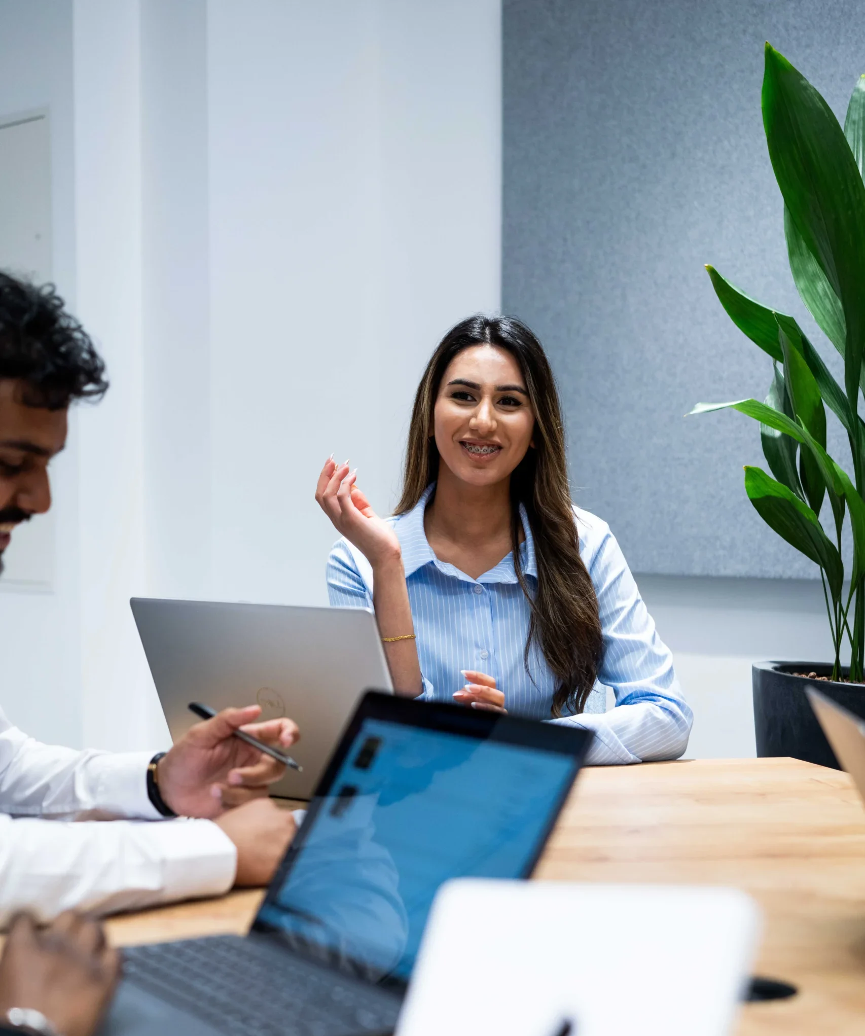 Master of Business Administration Career Prospects - woman smiling during business meeting with colleagues