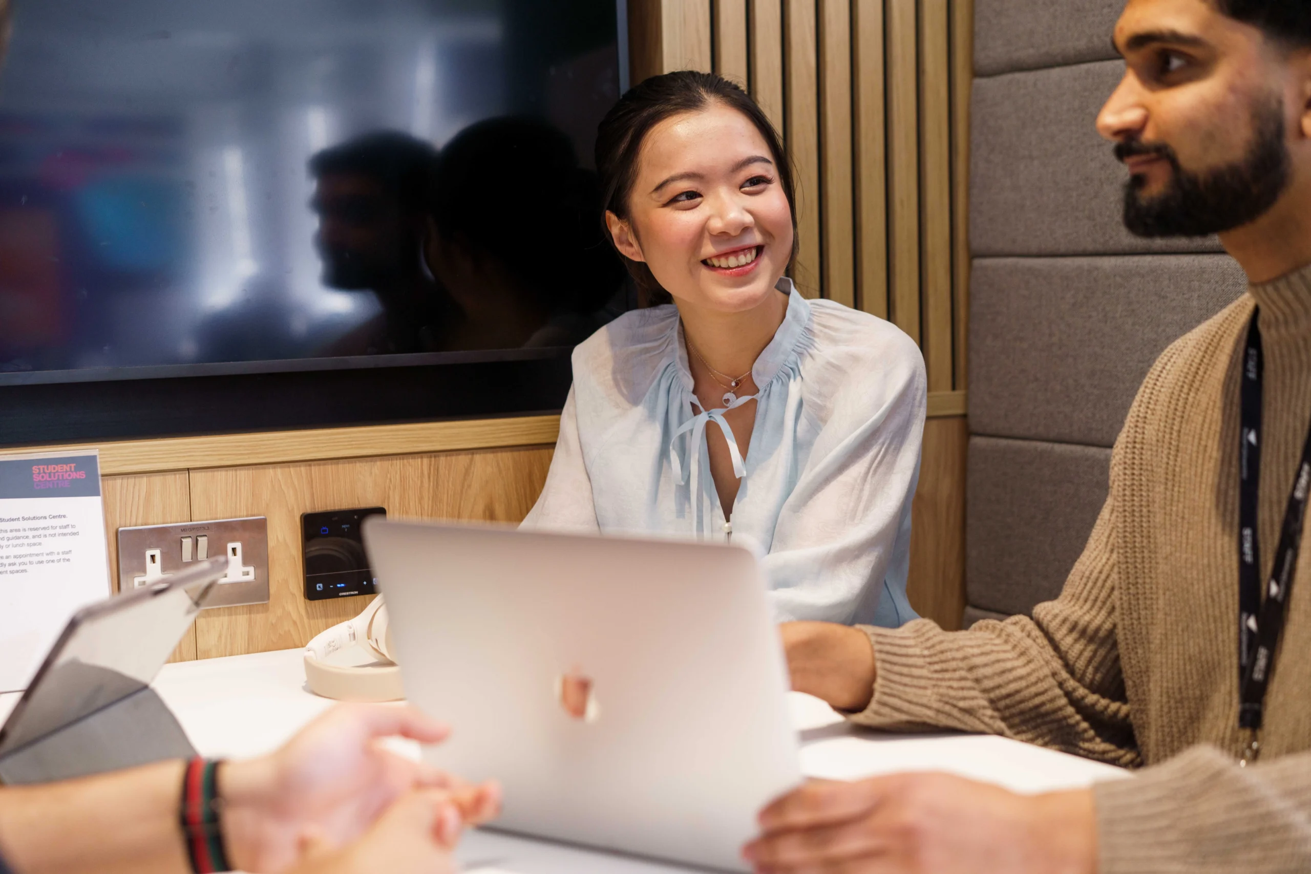 Aston Online MBA - Support from application to graduation - woman working on laptop, smiling