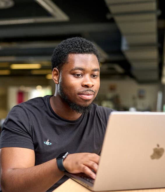 Aston Online Events on-demand - man on computer looking for upcoming webinars and virtual sessions