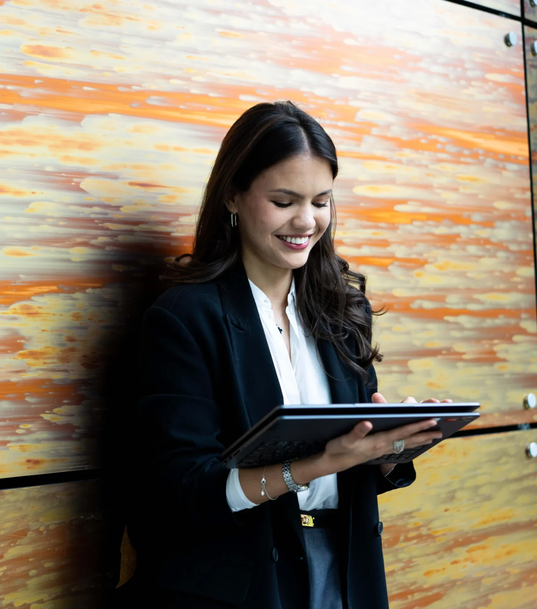 Aston Online - Student Finance Northern Ireland application process - woman looking down at screen