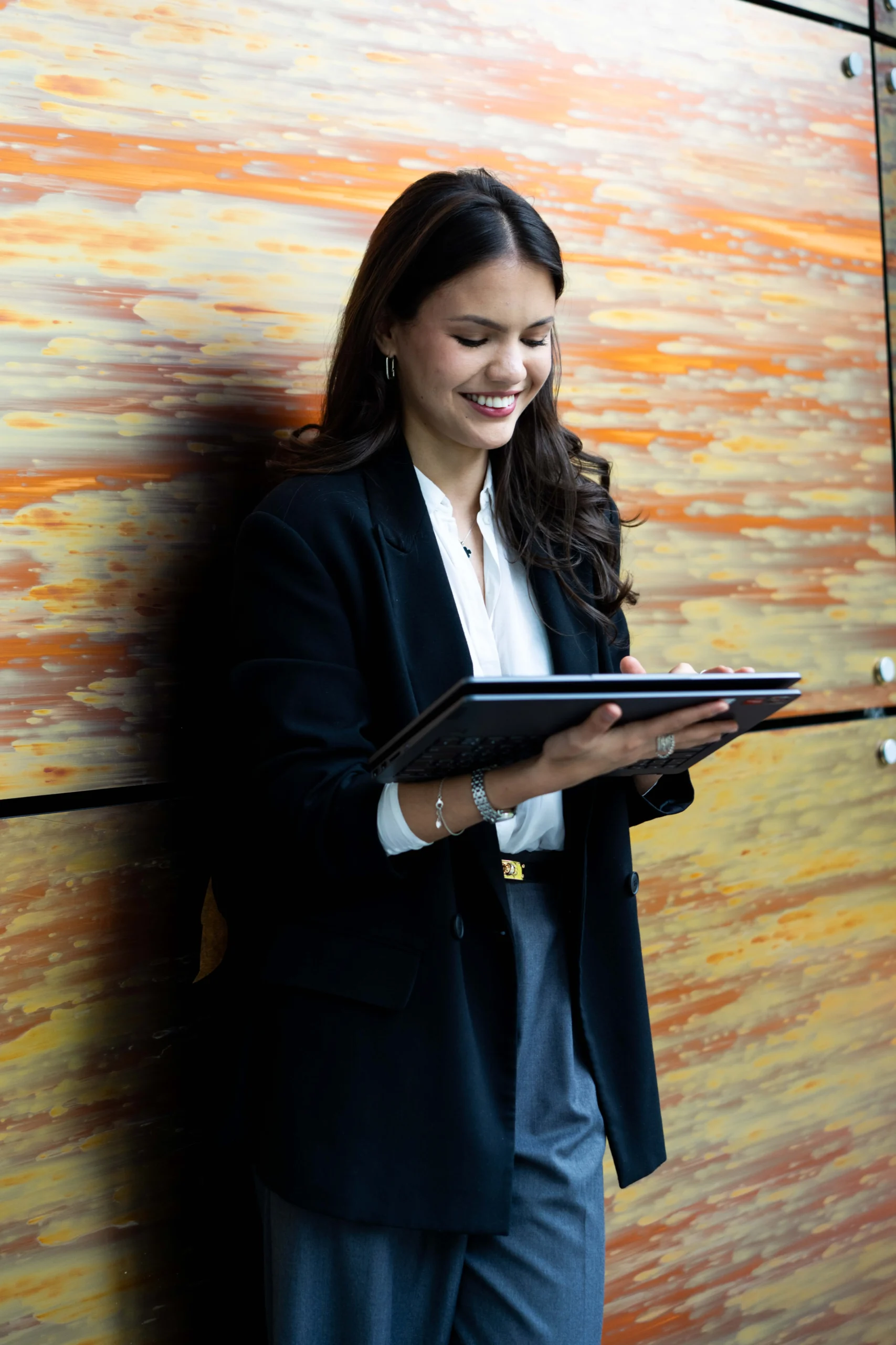 Aston Online - Student Finance Northern Ireland application process - woman looking down at screen